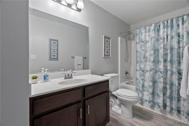 319 Wendenburg Ter, King William, VA 23009 - full bathroom with vanity, shower / bathtub combination with curtain, toilet, and wood finished floors