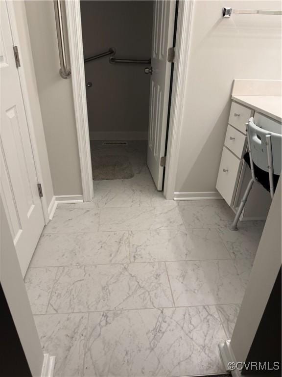 12003 Warrington Ct Unit 12003, Henrico, VA 23233 - bathroom featuring marble look tiles, vanity, and baseboards