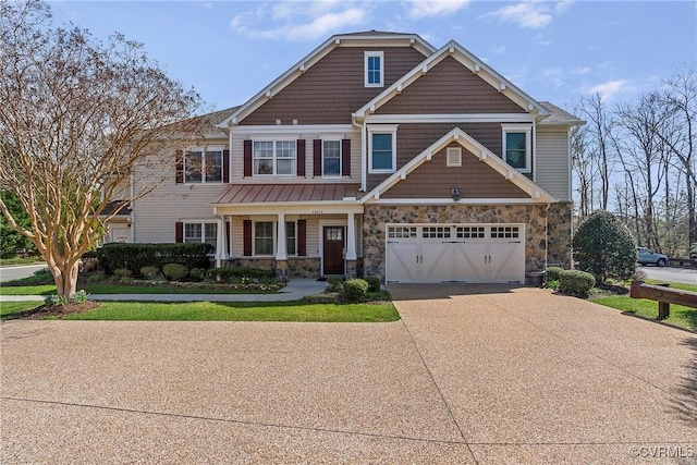 3401 Coles Point Way Unit A, Henrico, VA 23060 - craftsman house featuring stone siding, a garage, driveway, and covered porch
