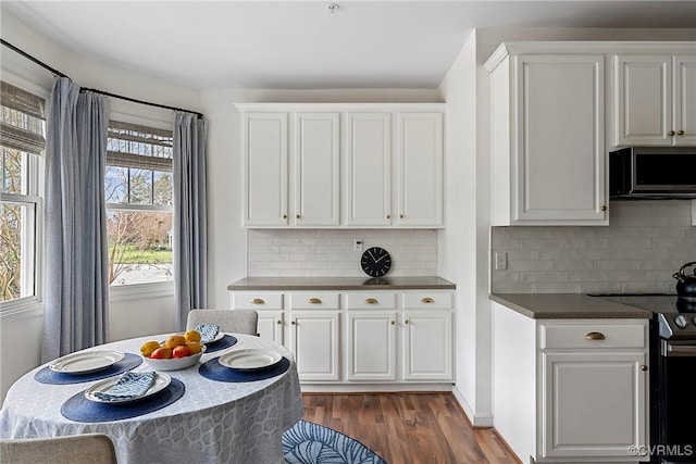 3401 Coles Point Way Unit A, Henrico, VA 23060 - kitchen featuring stainless steel appliances, dark wood-type flooring, dark countertops, white cabinets, and decorative backsplash