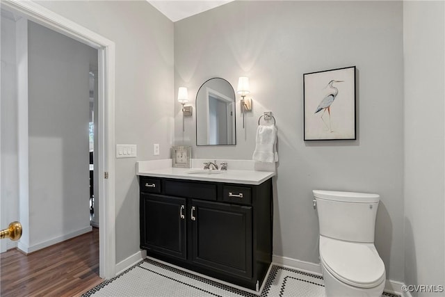3401 Coles Point Way Unit A, Henrico, VA 23060 - bathroom with vanity, toilet, baseboards, and wood finished floors