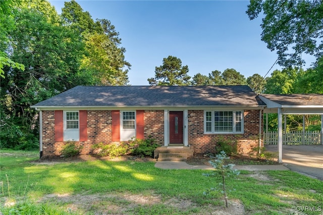 3411 Sylvania Rd, Chester, VA 23831 - ranch-style house featuring brick siding, a front lawn, and a carport