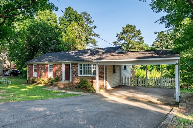 3411 Sylvania Rd, Chester, VA 23831 - view of front facade featuring brick siding, asphalt driveway, and an attached carport