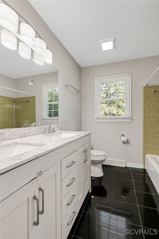 3411 Sylvania Rd, Chester, VA 23831 - full bath featuring double vanity, tile patterned flooring, toilet, and baseboards