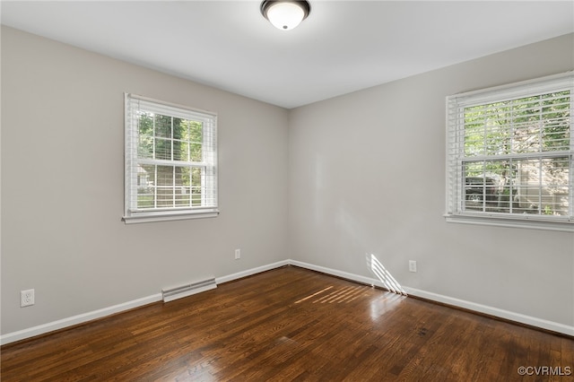3411 Sylvania Rd, Chester, VA 23831 - spare room with baseboards, plenty of natural light, and wood finished floors
