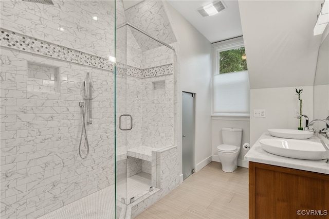 912 S Gaskins Rd, Henrico, VA 23238 - full bathroom featuring a stall shower, toilet, double vanity, baseboards, and vaulted ceiling