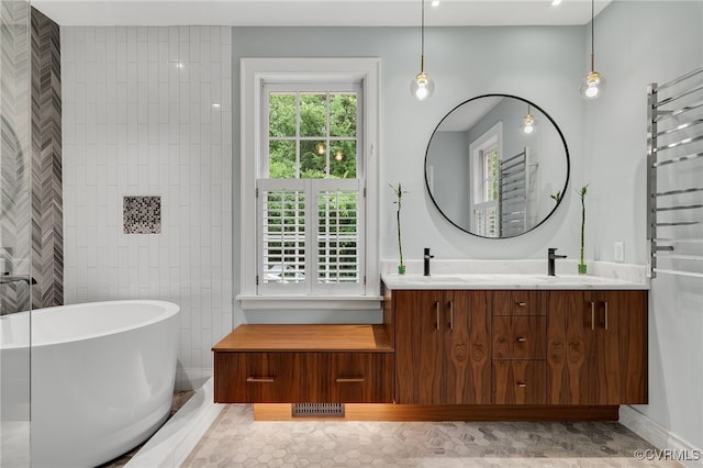 912 S Gaskins Rd, Henrico, VA 23238 - full bath with double vanity, a freestanding tub, and tile patterned flooring