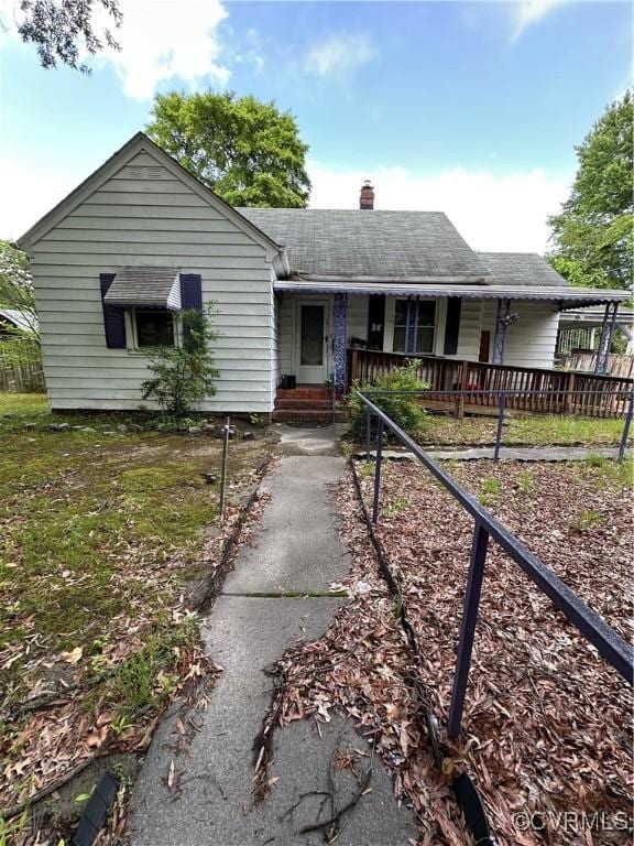 3905 N Ave, Richmond, VA 23222 - single story home with a chimney, covered porch, and a shingled roof