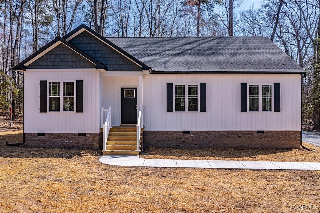 3135 Irvington Rd, Irvington, VA 22480 - view of front facade featuring crawl space and a shingled roof