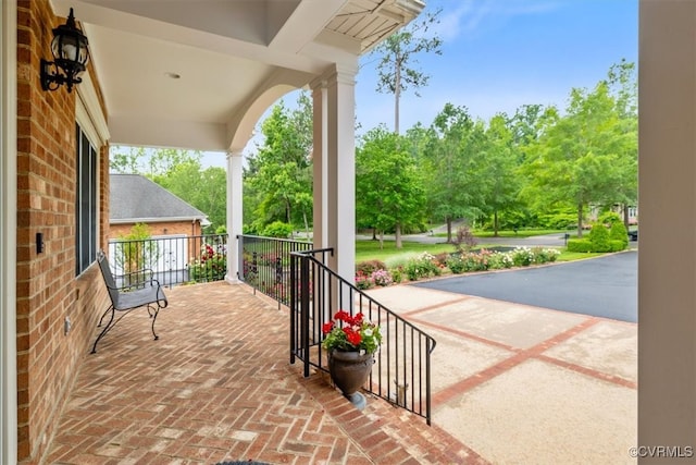 311 Victoria Way, Richmond, VA 23238 - covered porch with view of wooded area