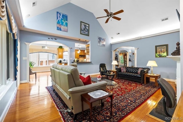 311 Victoria Way, Richmond, VA 23238 - living room featuring arched walkways, ceiling fan, wood finished floors, decorative columns, and high vaulted ceiling