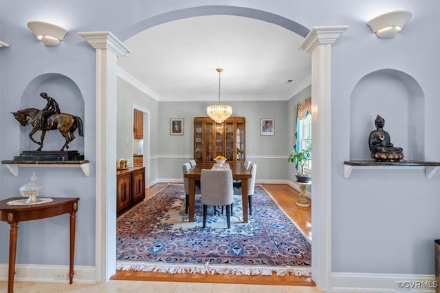 311 Victoria Way, Richmond, VA 23238 - dining area with decorative columns, a chandelier, wood finished floors, ornamental molding, and baseboards