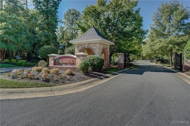311 Victoria Way, Richmond, VA 23238 - view of asphalt street featuring curbs, a gated entry, and view of wooded area