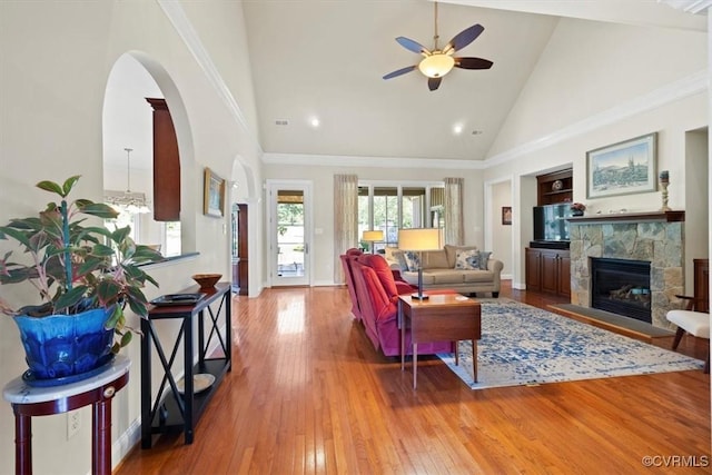 403 Regina Ln, Richmond, VA 23238 - living area with a ceiling fan, high vaulted ceiling, hardwood / wood-style floors, a stone fireplace, and arched walkways