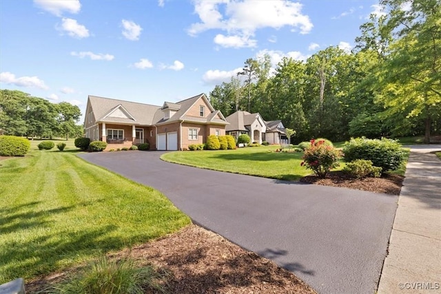 403 Regina Ln, Richmond, VA 23238 - view of front facade with an attached garage, driveway, and a front lawn