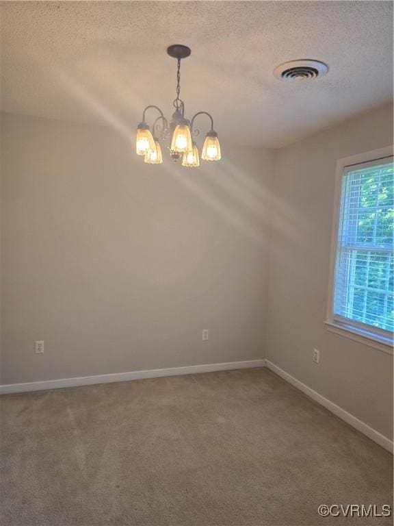 6448 Blair Ct, Prince George, VA 23875 - carpeted empty room featuring a textured ceiling and a chandelier