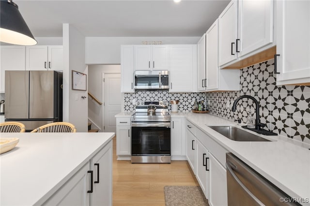 1900 Roseneath Rd Unit 8B, Richmond, VA 23230 - kitchen featuring stainless steel appliances, a sink, and light countertops