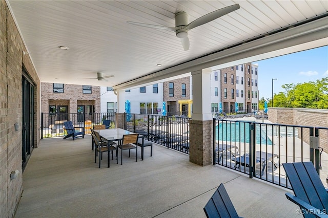 1900 Roseneath Rd Unit 8B, Richmond, VA 23230 - view of patio featuring a ceiling fan, outdoor dining space, and a community pool