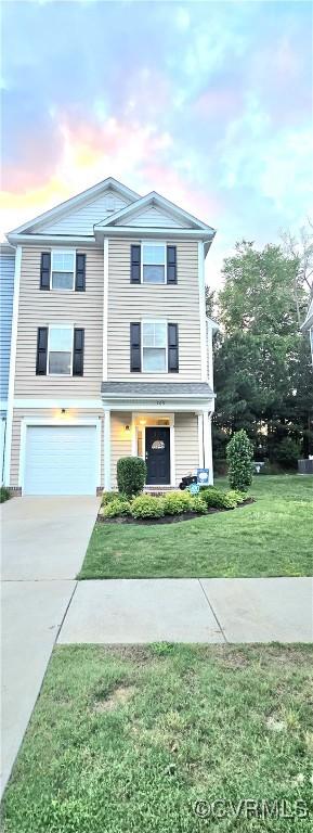 705 Prosperity Ct Unit 705, Williamsburg, VA 23188 - view of front of home featuring driveway, a garage, and a lawn