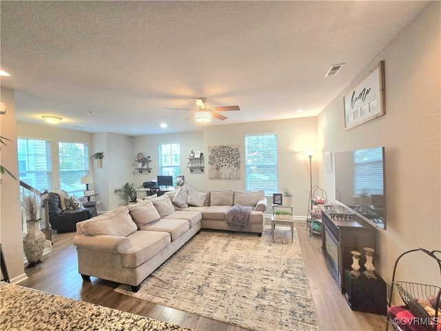 705 Prosperity Ct Unit 705, Williamsburg, VA 23188 - living area featuring light wood-style flooring, ceiling fan, a textured ceiling, recessed lighting, and baseboards
