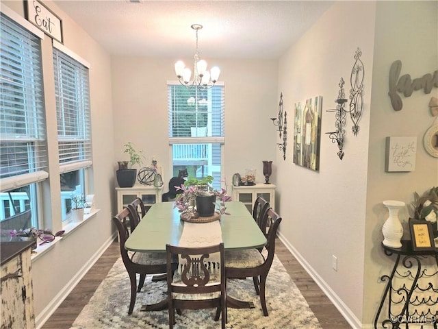 705 Prosperity Ct Unit 705, Williamsburg, VA 23188 - dining space featuring dark wood finished floors, a chandelier, and baseboards