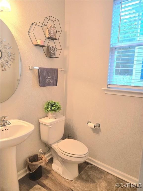 705 Prosperity Ct Unit 705, Williamsburg, VA 23188 - half bathroom with toilet, plenty of natural light, baseboards, and a sink