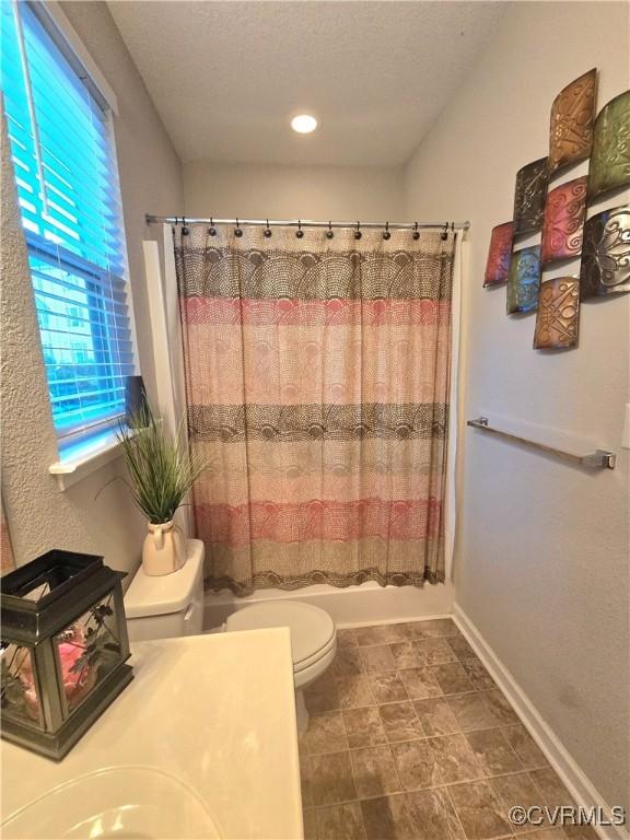 705 Prosperity Ct Unit 705, Williamsburg, VA 23188 - bathroom featuring toilet, a textured ceiling, shower / bath combo, vanity, and baseboards