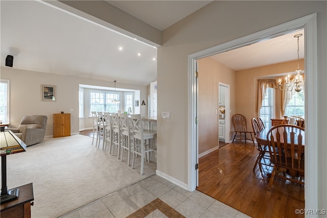 16180 Janet Dr, Amelia Courthouse, VA 23002 - tiled dining space featuring vaulted ceiling, baseboards, a chandelier, carpet floors, and recessed lighting