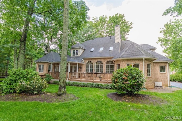 5605 Hunters Glen Dr, Glen Allen, VA 23059 - back of house featuring brick siding, a yard, a deck, a chimney, and a shingled roof