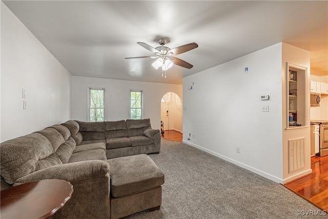 12009 Beaver Spring Ct, Midlothian, VA 23112 - living room with arched walkways, ceiling fan, and carpet