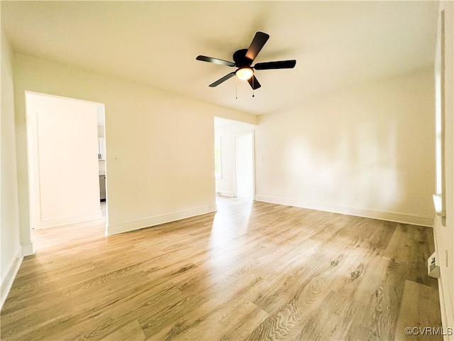 1857 Brunswick Rd, Blackstone, VA 23824 - empty room with light wood-style floors, a ceiling fan, and baseboards