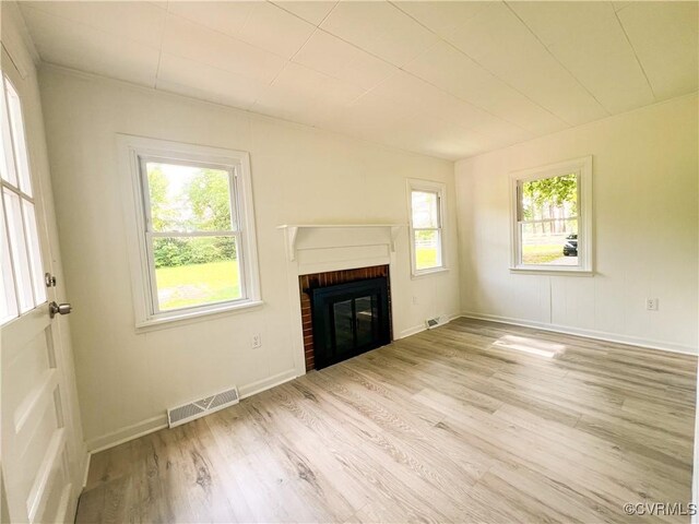 1857 Brunswick Rd, Blackstone, VA 23824 - unfurnished living room with wood finished floors, a fireplace, and baseboards