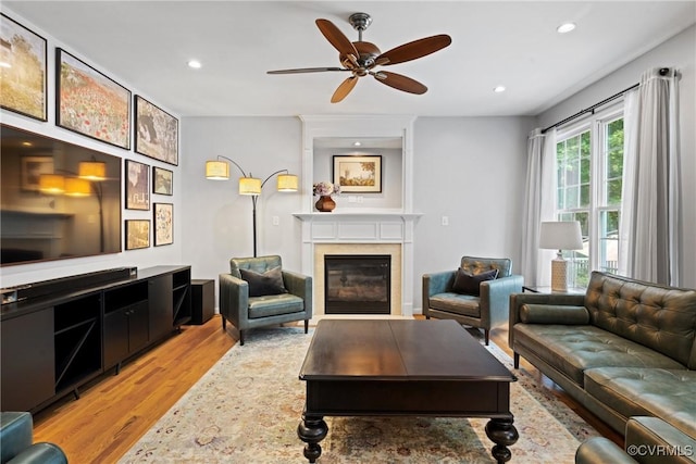 11137 Sterling Cove Dr, Chesterfield, VA 23838 - living area with wood finished floors, a glass covered fireplace, recessed lighting, and a ceiling fan