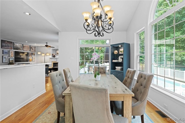 11137 Sterling Cove Dr, Chesterfield, VA 23838 - dining space with a chandelier, healthy amount of natural light, lofted ceiling, light wood finished floors, and ceiling fan