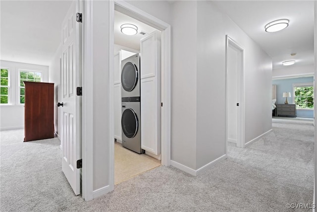 11137 Sterling Cove Dr, Chesterfield, VA 23838 - laundry area featuring estacked washer and dryer, light colored carpet, and baseboards
