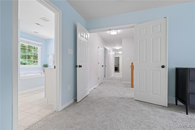 11137 Sterling Cove Dr, Chesterfield, VA 23838 - hallway with carpet, baseboards, and tile patterned floors