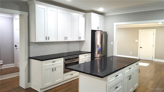 1118 27th, Richmond, VA 23223 - kitchen with stainless steel appliances, dark wood finished floors, tasteful backsplash, crown molding, and recessed lighting
