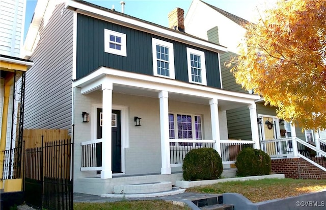 1118 27th, Richmond, VA 23223 - view of front of house with covered porch and a chimney