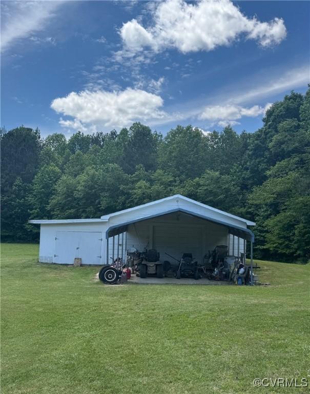 2095 Beef Rd, Greenville, VA 23847 - view of car parking featuring a carport and a forest view