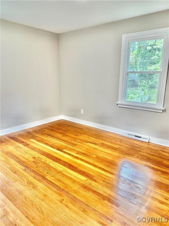8409 Zell Ln, Henrico, VA 23229 - unfurnished room with wood finished floors and baseboards