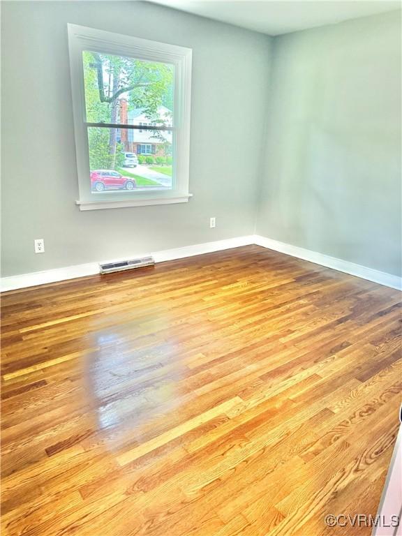 8409 Zell Ln, Henrico, VA 23229 - spare room with wood finished floors and baseboards