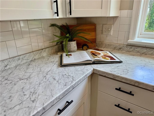 8409 Zell Ln, Henrico, VA 23229 - kitchen with tasteful backsplash and white cabinetry