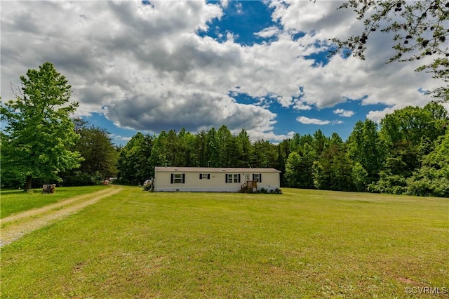 19083 Country Rd, Beaverdam, VA 23015 - manufactured / mobile home featuring a front yard and a forest view