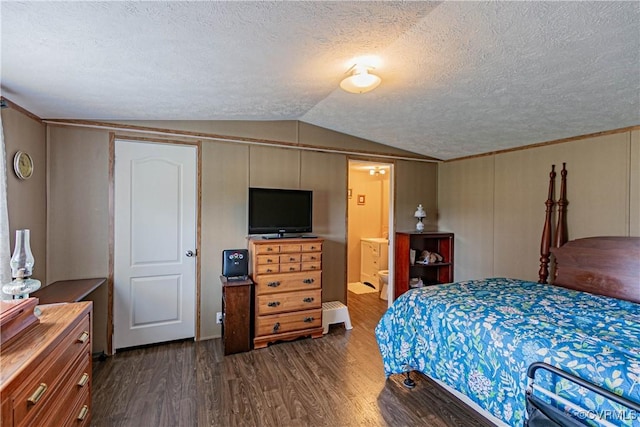 19083 Country Rd, Beaverdam, VA 23015 - bedroom with vaulted ceiling, dark wood-style flooring, a textured ceiling, and ensuite bath