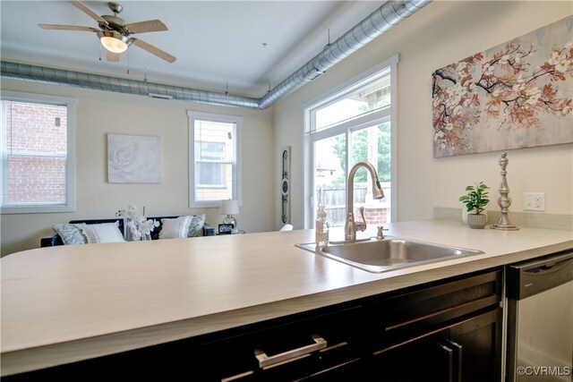 1020 Porter St Unit 103, Richmond, VA 23224 - kitchen featuring dishwasher, a sink, a ceiling fan, and light countertops