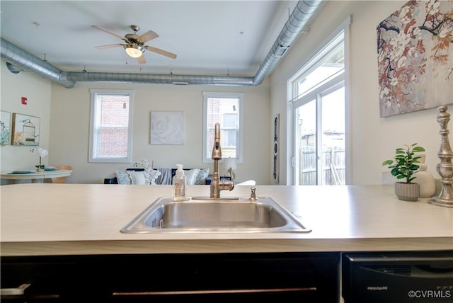 1020 Porter St Unit 103, Richmond, VA 23224 - kitchen with a sink, black dishwasher, a ceiling fan, and light countertops