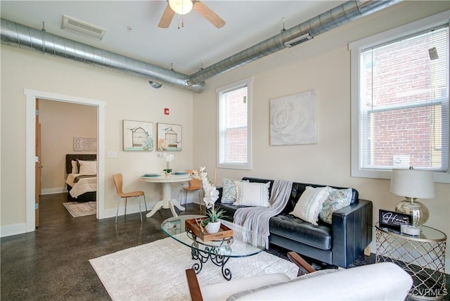 1020 Porter St Unit 103, Richmond, VA 23224 - living room featuring plenty of natural light, a ceiling fan, and baseboards