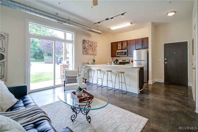 1020 Porter St Unit 103, Richmond, VA 23224 - living area featuring track lighting and baseboards