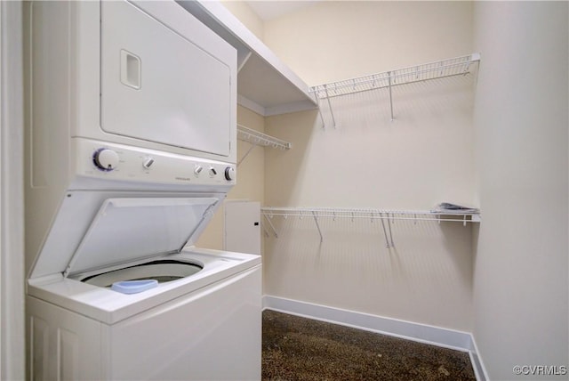 1020 Porter St Unit 103, Richmond, VA 23224 - laundry area with stacked washer / dryer and baseboards