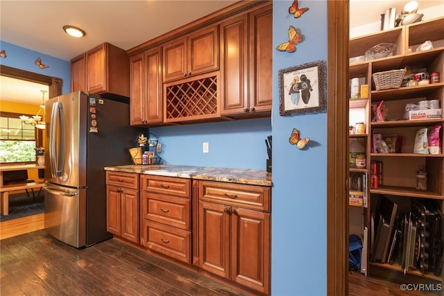 14421 Clazemont Rd, Montpelier, VA 23192 - kitchen with freestanding refrigerator, a chandelier, brown cabinets, and dark wood-type flooring
